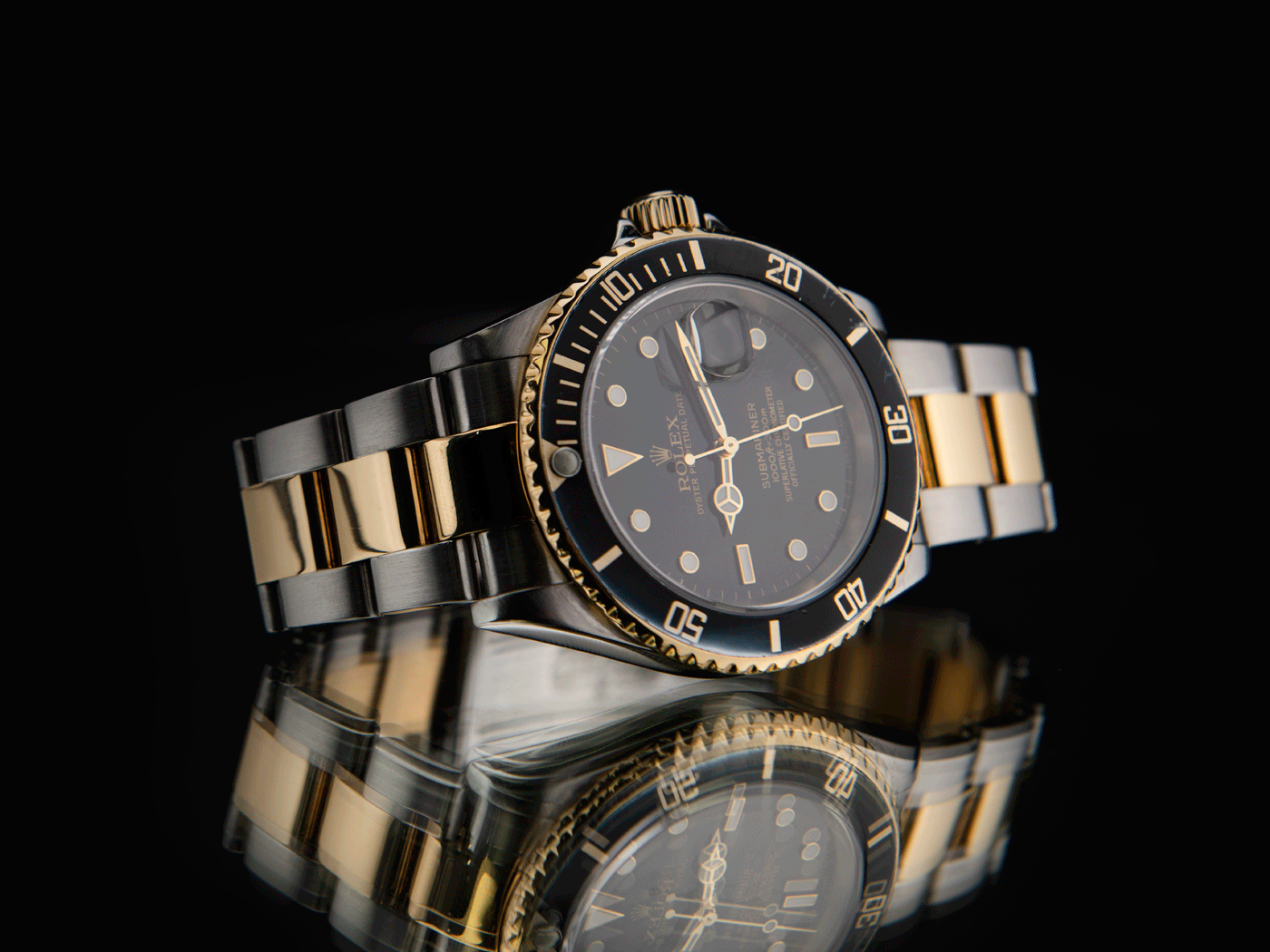 Black dial and bezel Submariner with a two-tone Silver and Gold bracelet