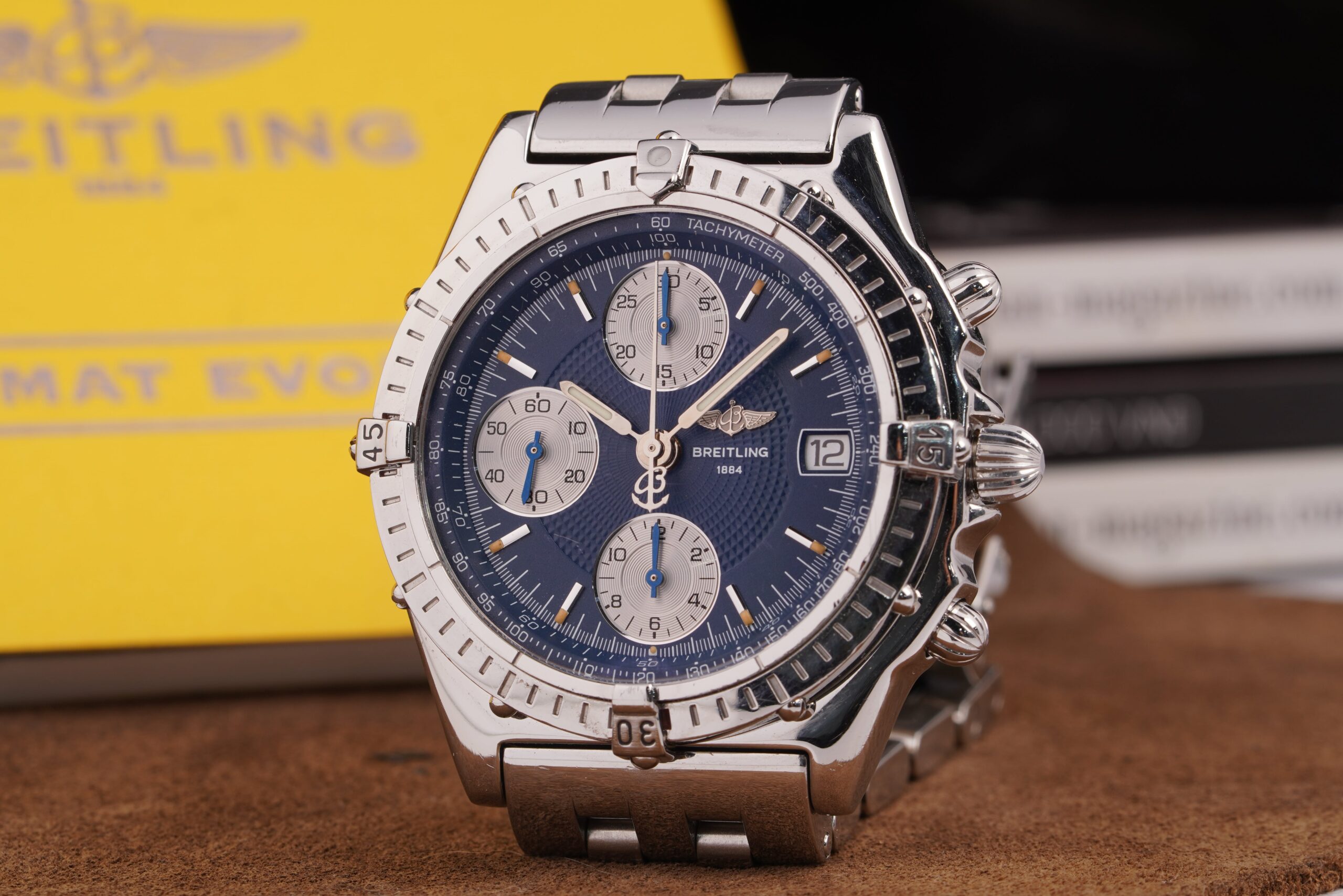 A silver bezel and blue dial Breitling watch
